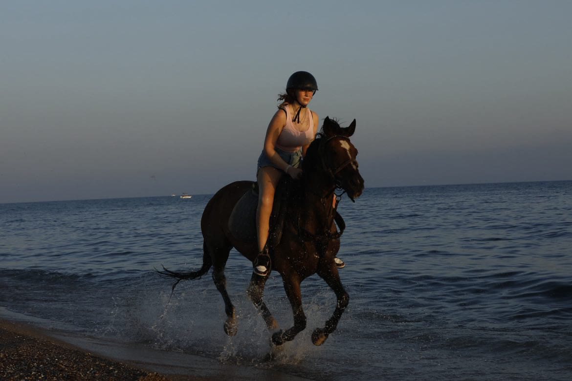 Riders on a long tour at dusk